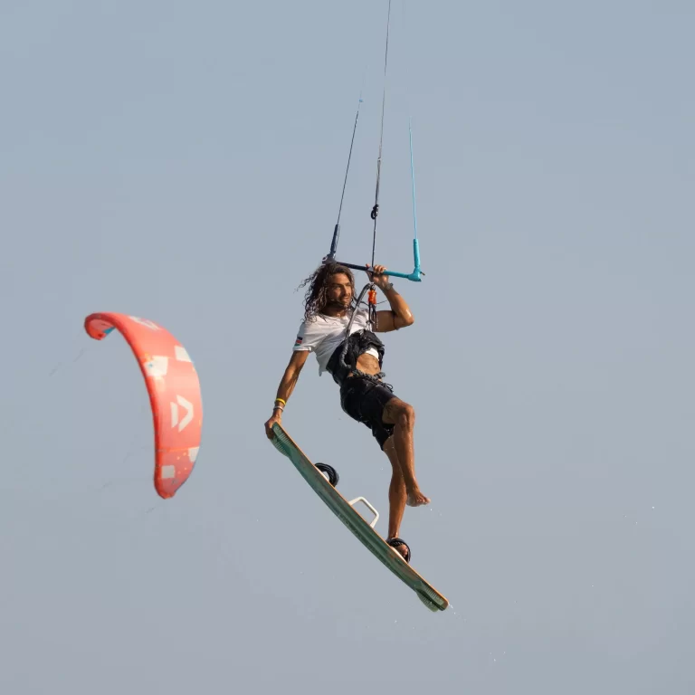 Traveler performing a tail grab trick during an African adventure